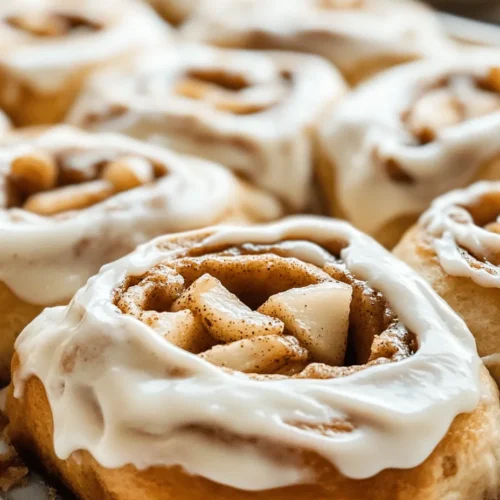 There's something undeniably comforting about homemade cinnamon rolls, an indulgent treat that combines warm, pillowy dough with the fragrant aromas of cinnamon and sugar. This classic breakfast item has captured the hearts of many, becoming a beloved staple in kitchens across the globe. However, when you elevate this traditional recipe with the addition of fresh apples and a luscious cream cheese frosting, you create a dessert that is not only irresistible but also bursting with flavor.